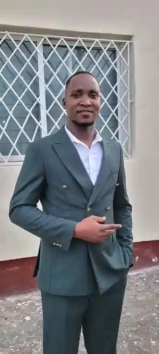 Emmanuel in formal suit
