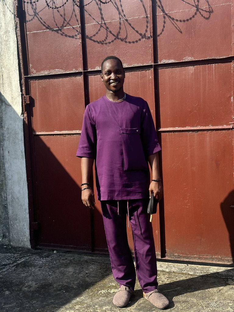Emmanuel in purple traditional wear